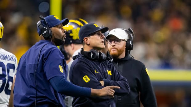 Michigan Sherrone Moore head coach Jim Harbaugh special teams coordinator Jay Harbaugh